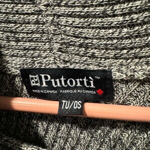 Women’s black & white diagonal cut poncho.